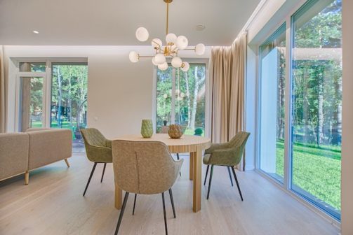 round brown wooden piece dining set in a room