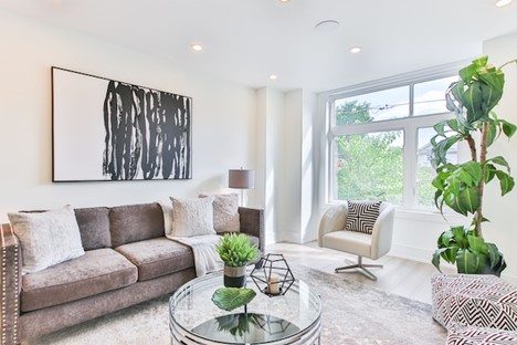 A living room decorated with neutral colors.